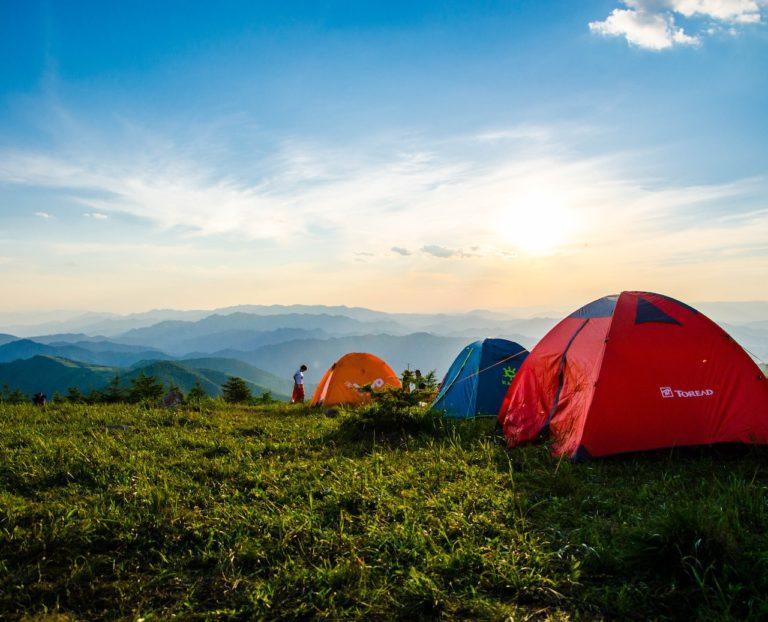 Pitched Dome Tents Overlooking Mountain Ranges on hiking holiday