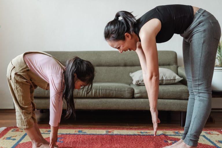 Mum and daughter practicing eudaimonic well-being by exercising and socialising together