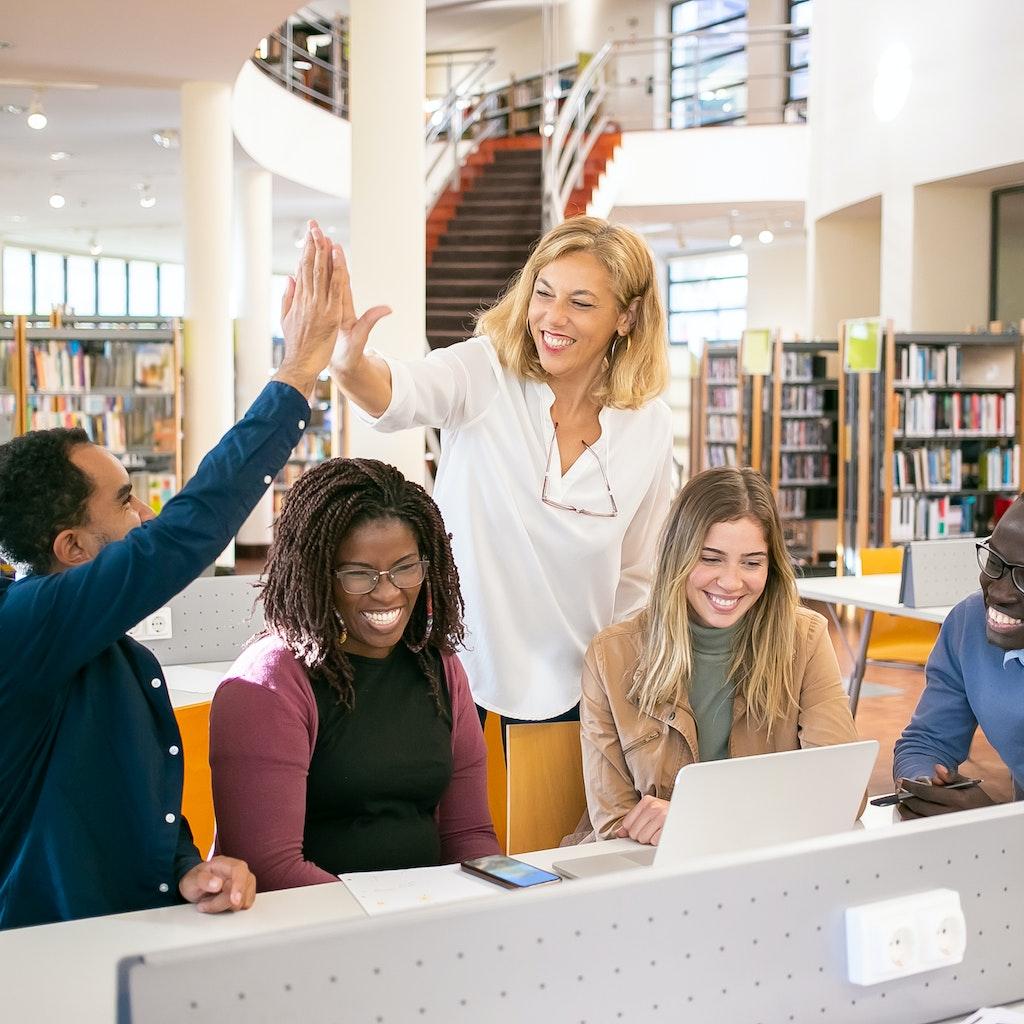 A teacher being in a career that she loves and surrounded by happy students