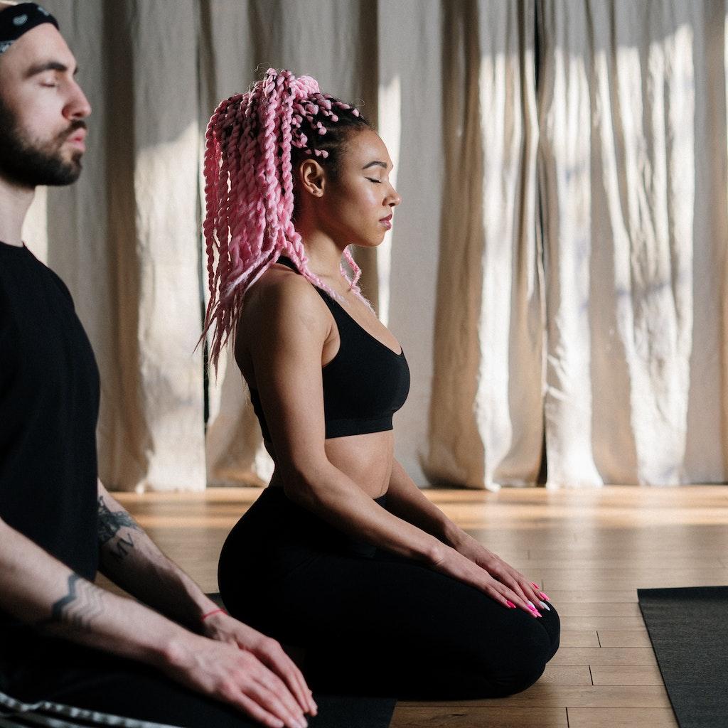 Man and woman meditating