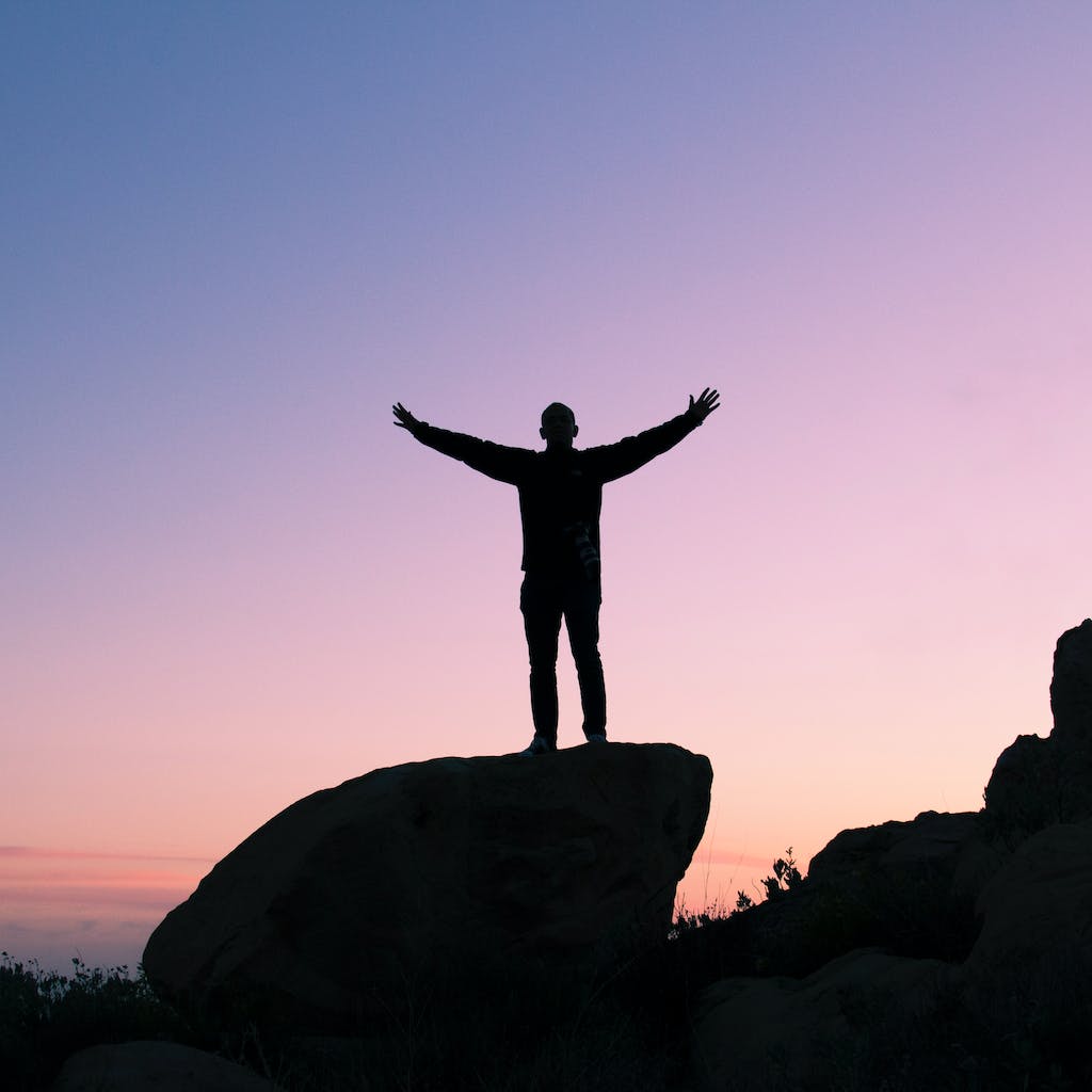 Person feeling elevated after incorporating Affirmations into their daily life as they Practice Eudaimonic Well-being.