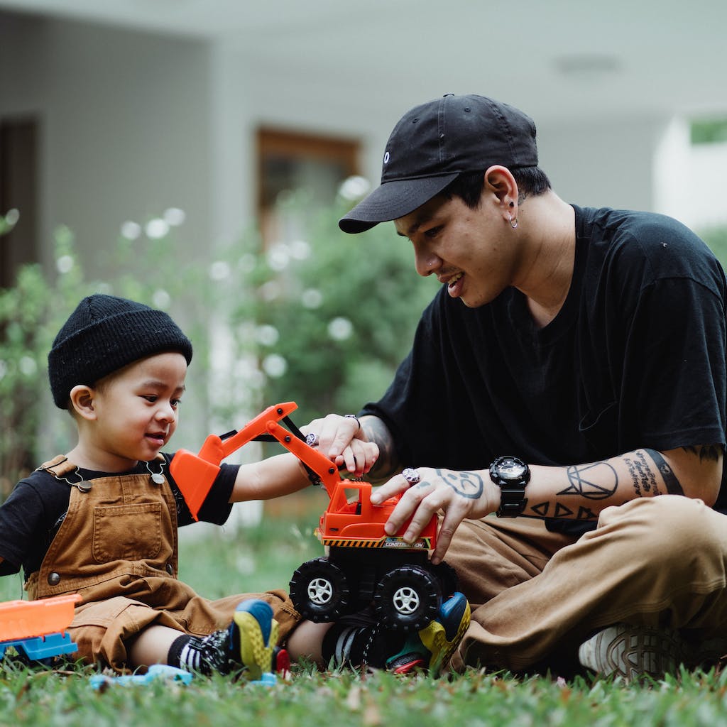 Father and son playing in the garden