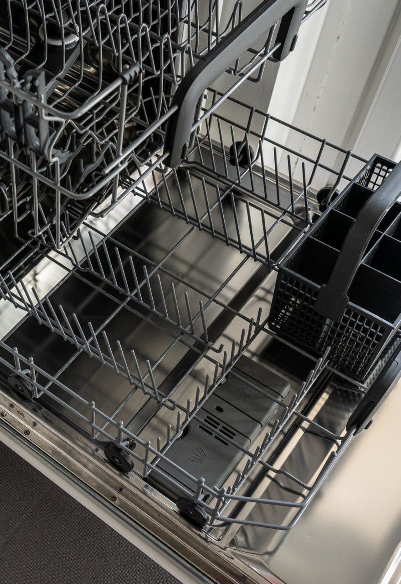 Clean dishwasher with the drawers open