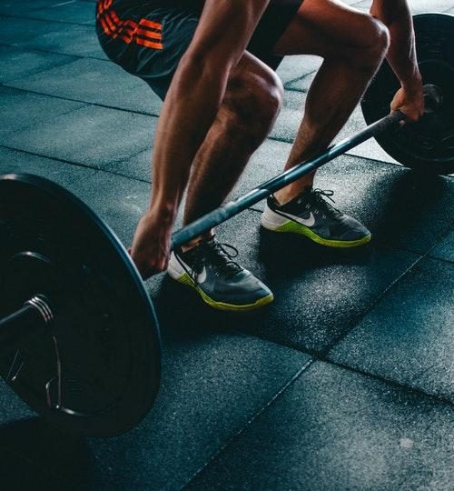 Man lifting barbell at the gym